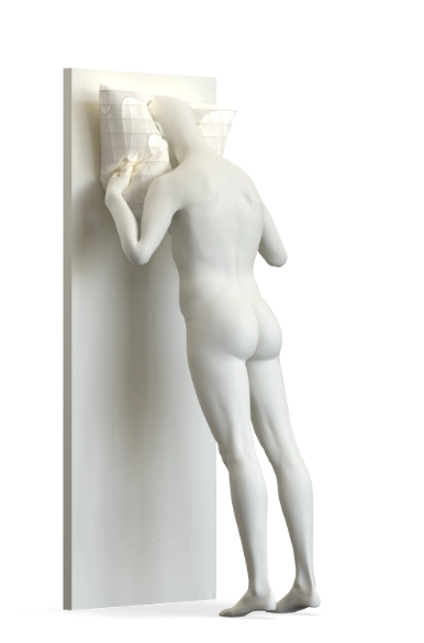 Product shot of a white Hans Boodt mannequin from the Blend — Frozen in Time collection pressing its face and hands into a wall-mounted panel, with a quilted geometric surface element at head height. The figure is nude and seen from behind. Shot with a translucent background.