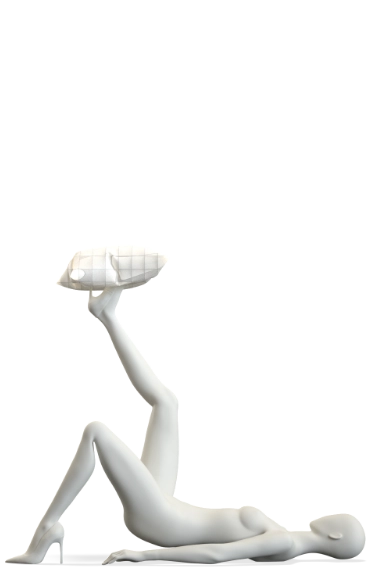 Product shot of a white Hans Boodt mannequin from the Blend — Frozen in Time collection lying on its back, legs raised and extended, balancing a geometric faceted head form on its feet. A quilted white surface is integrated into the pose beneath the figure. Shot with a translucent background.