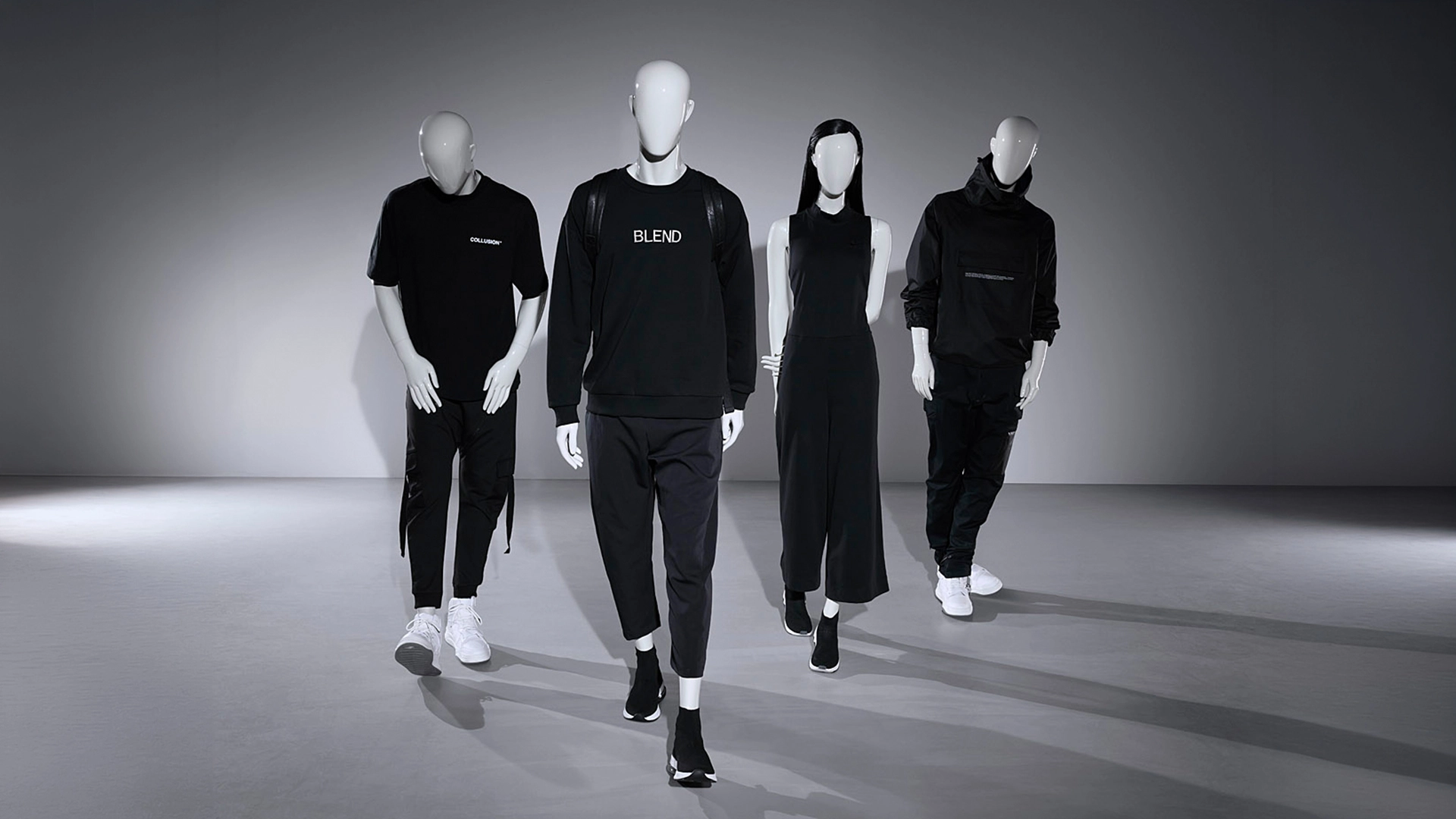 A group of female and male mannequins from the blend collection walking towards the camera