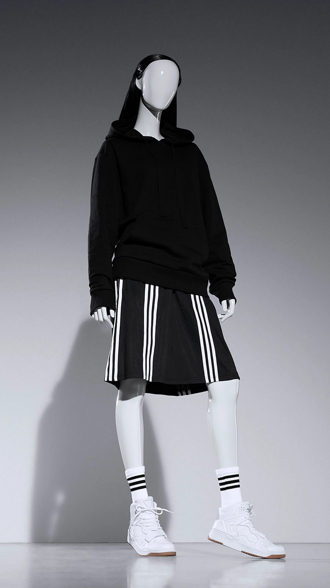 A female Blend mannequin in a black hoodie and skirt
