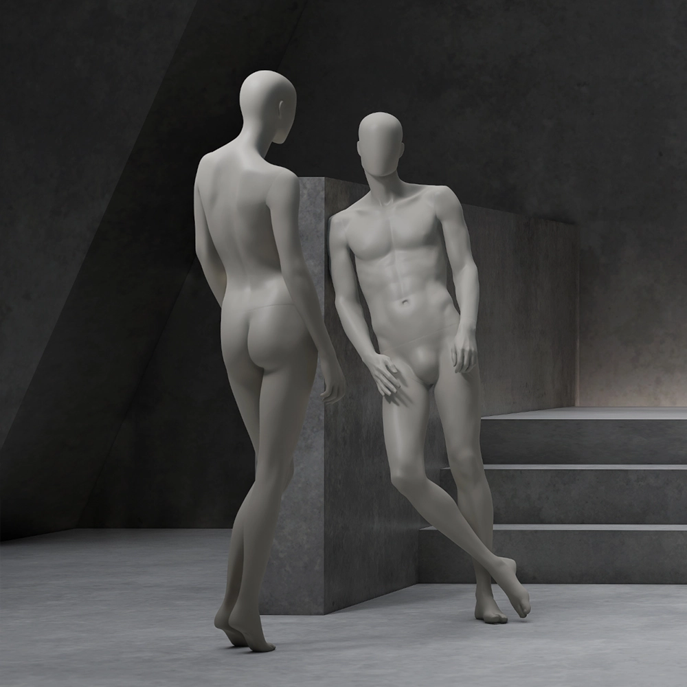 a pair of female and male mannequins from the casual collection looking at each other