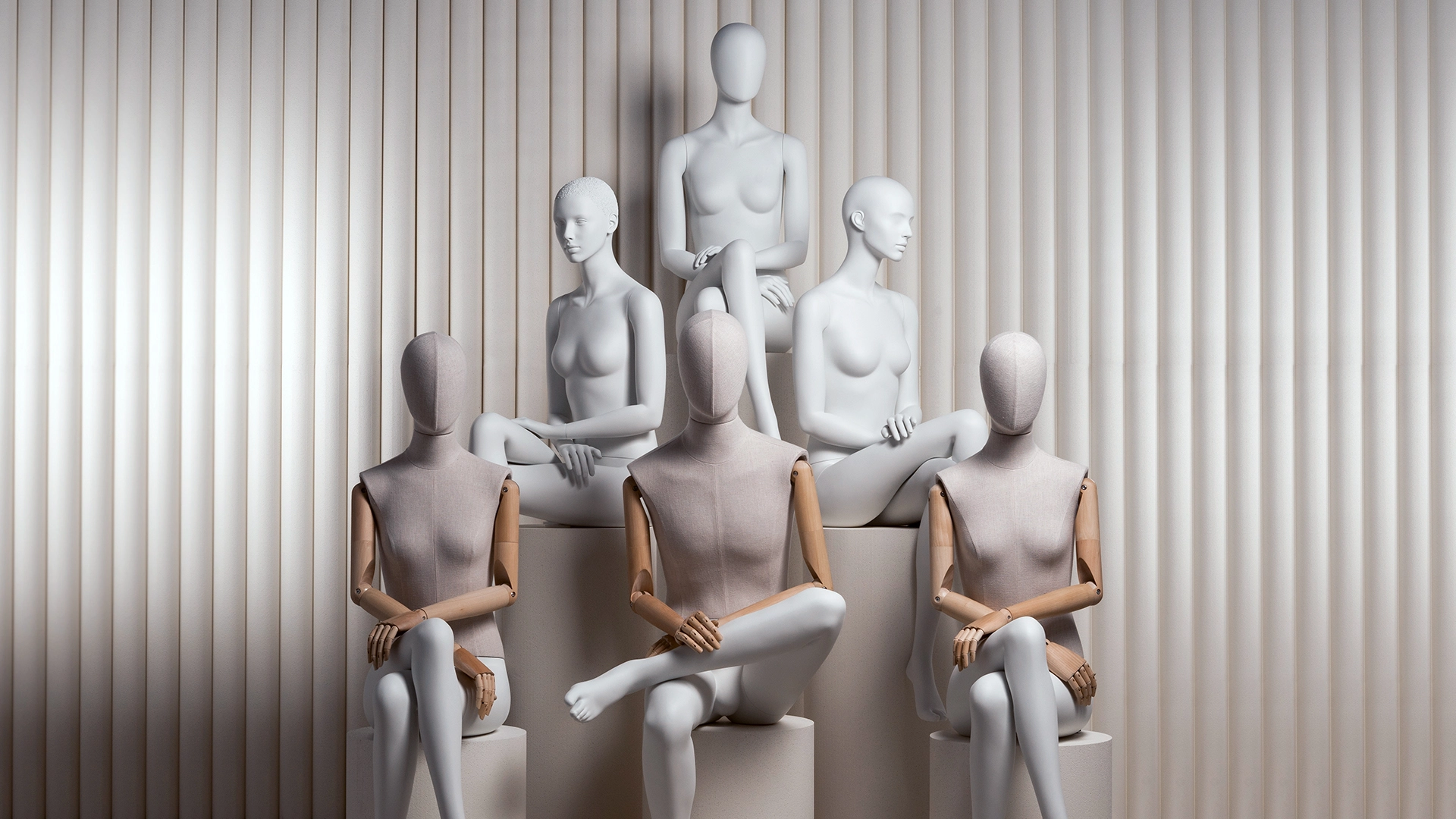 a group of male and female mannequins in articulated, fabric and nude finishes from the essential collection