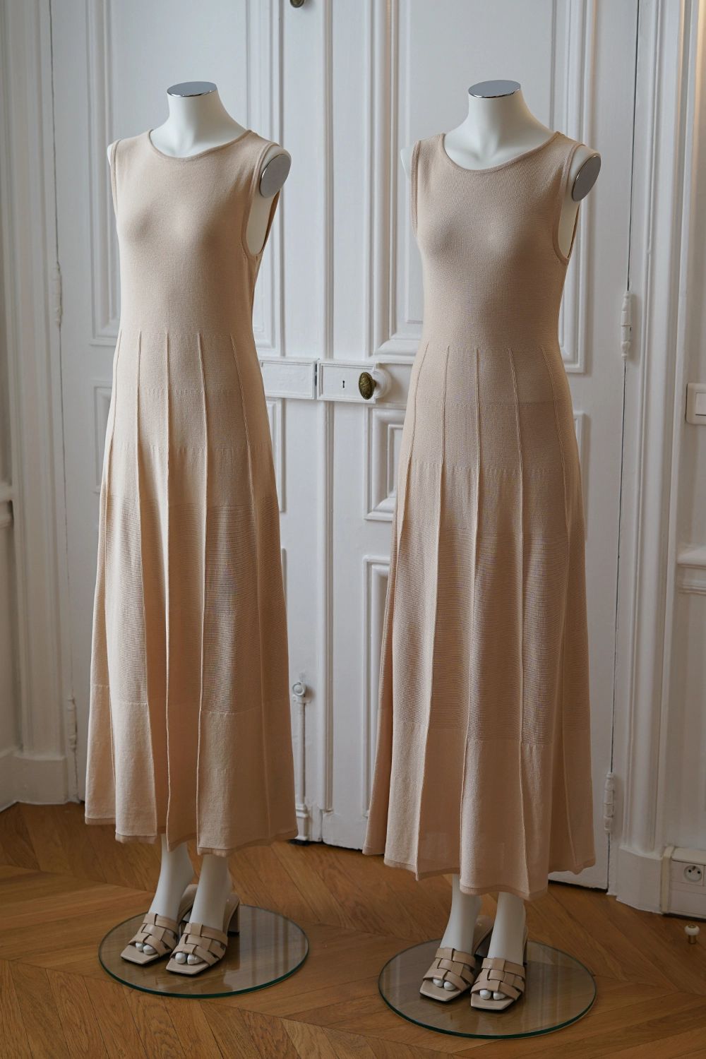 two female mannequins from the essential collection with arm caps and with neck caps, wearing long pink dresses
