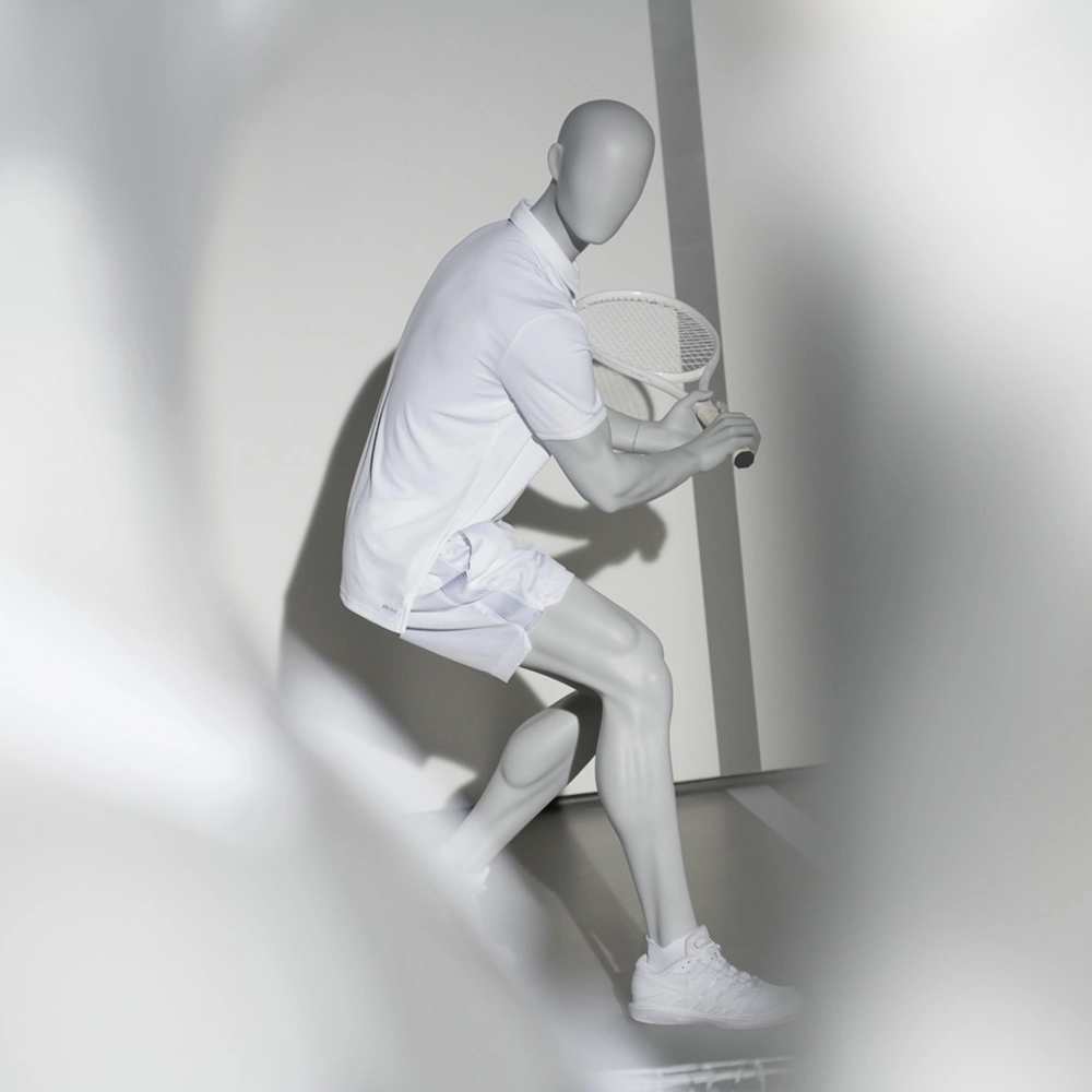 a male sport mannequin in a tennis pose